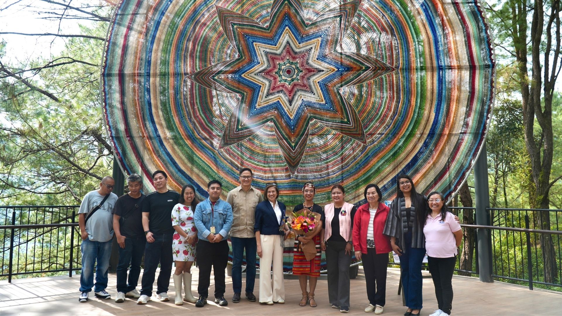 Adelaida Guia with Mt. Camisong Chairman Ludette Querubin, President Oliver Samala, and community leaders in front of the Wishing Star mandala on display at Mt. Camisong Forest Park